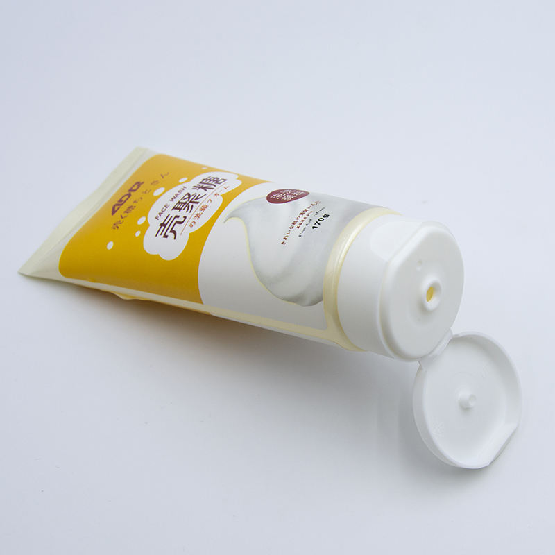 Tubo exprimidor de plástico blando OEM con tapa abatible para crema de manos, lavado de cara, cuidado de la piel con loción cosmética de superficie de estampado en caliente