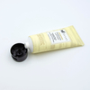 Tubo de lavado de cara cosmético suave OEM con superficie de estampado en caliente de tubo cosmético de plástico con tapa abatible