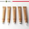 Tubo de plástico PE cosmético con cabezal de masaje de bola de acero inoxidable, aplicador de cepillo para brillo de labios y loción, embalaje cosmético