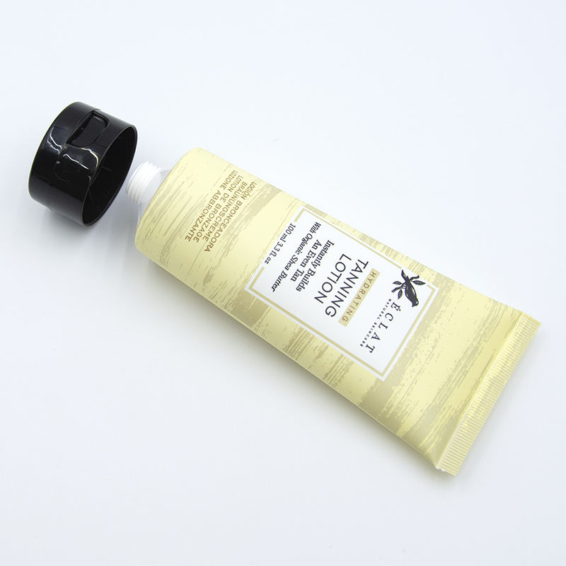 Tubo de lavado de cara cosmético suave OEM con superficie de estampado en caliente de tubo cosmético de plástico con tapa abatible