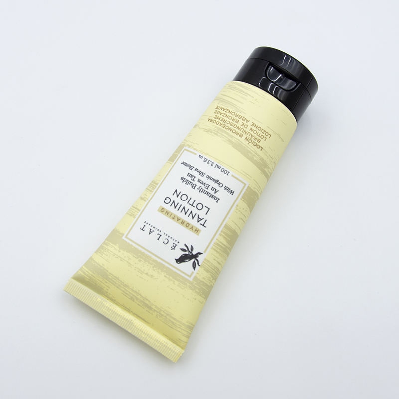 Tubo de lavado de cara cosmético suave OEM con superficie de estampado en caliente de tubo cosmético de plástico con tapa abatible