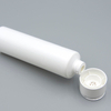 Tubo cosmético de plástico de fábrica para crema para ojos, mascarilla, protector solar, tubo exprimidor con embalaje con tapa abatible