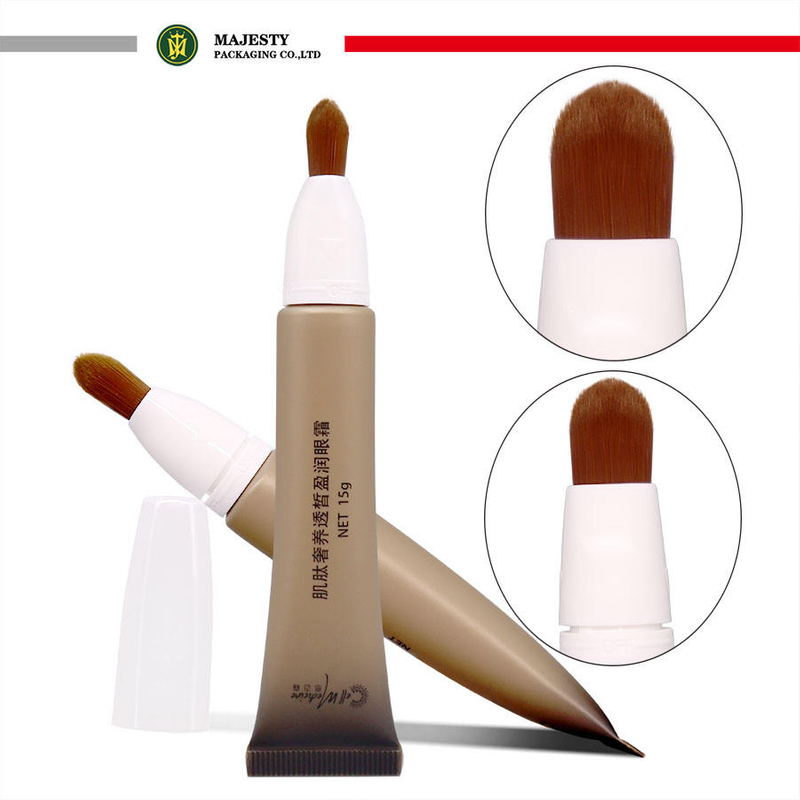 Tubo de plástico OEM con cabezal de cepillo, manejo de superficie de estampado en caliente para colorete, crema para ojos, herramienta cosmética con loción