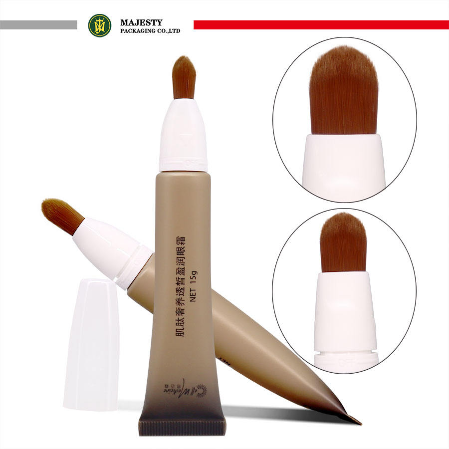 Tubo de plástico OEM con cabezal de cepillo, manejo de superficie de estampado en caliente para colorete, crema para ojos, herramienta cosmética con loción